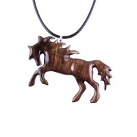 A wooden horse pendant necklace with a black cord. The horse is brown and has a detailed mane and tail.