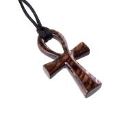 A wooden ankh pendant necklace with a black satin cord. The ankh is reddish-brown with a wood grain pattern.