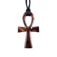 A wooden ankh pendant necklace with a black satin cord. The ankh is reddish-brown with a wood grain pattern.