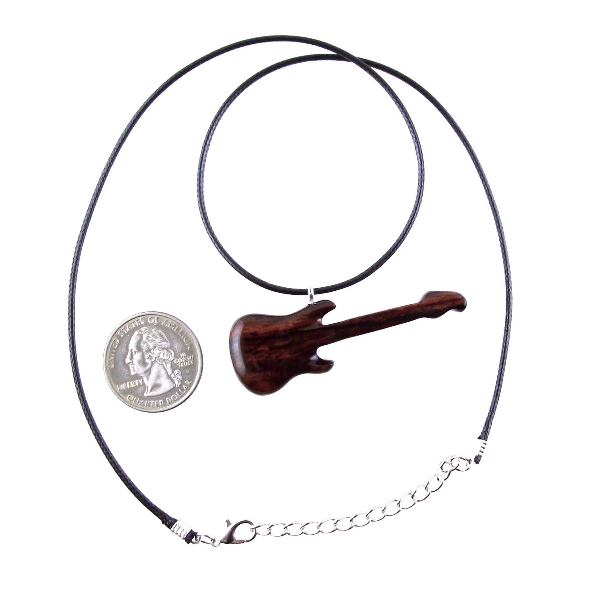 A wooden guitar pendant necklace with a black cord with silver lobster clasp. The guitar is dark reddish- brown with a wood grain pattern.