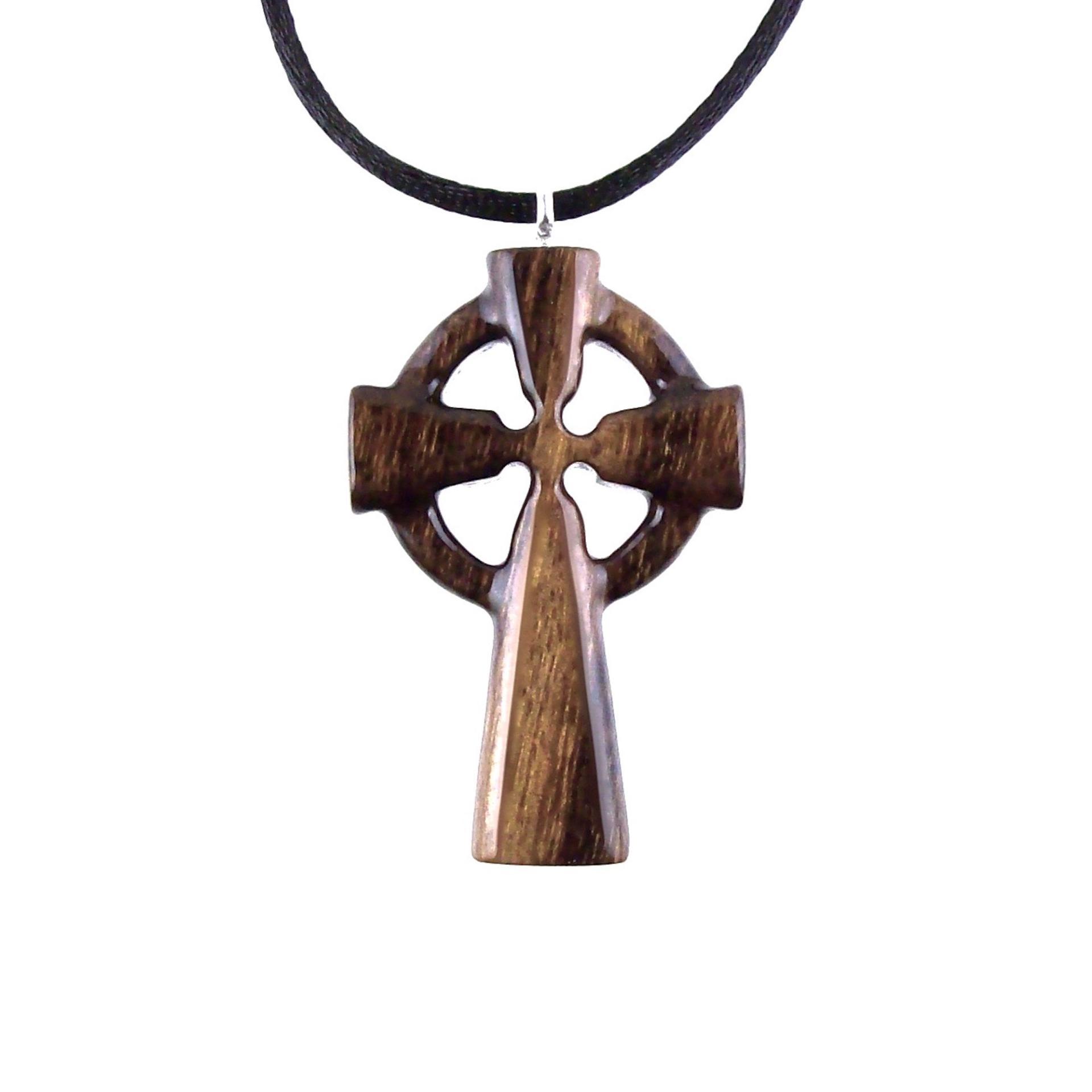 A brown wooden celtic cross pendant with black cord with glossy finish.