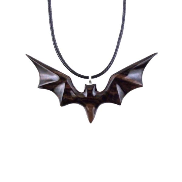 Black and brown reversible wooden flying bat pendant with 18 inches black cord necklace with lobster clasp.