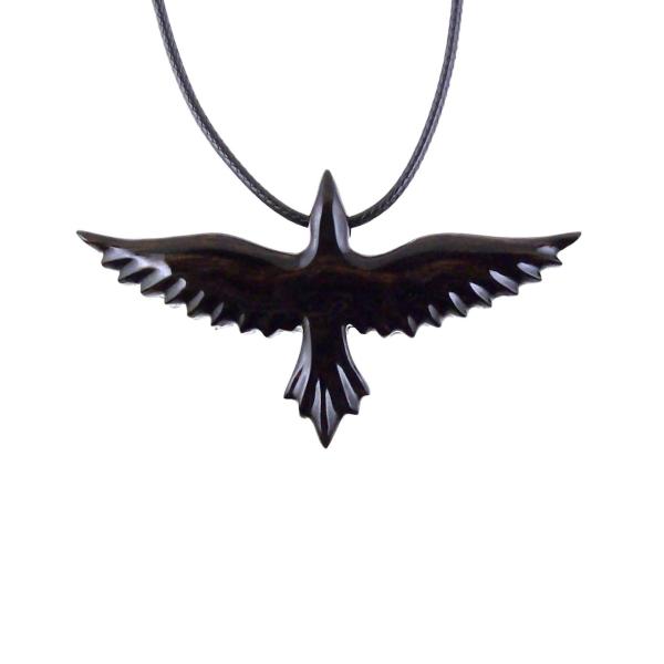 Black and brown reversible wooden flying raven pendant with 18 inches black cord necklace with lobster clasp.