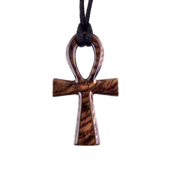 A wooden ankh pendant necklace with a black satin cord. The ankh is reddish-brown with a wood grain pattern.
