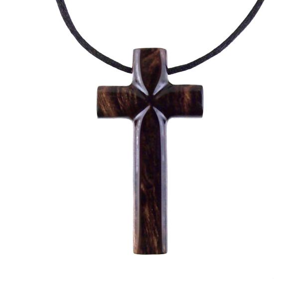 A dark brown wooden cross pendant on a black cord. The pendant has a glossy smooth finish emphasizing the wood grain.
